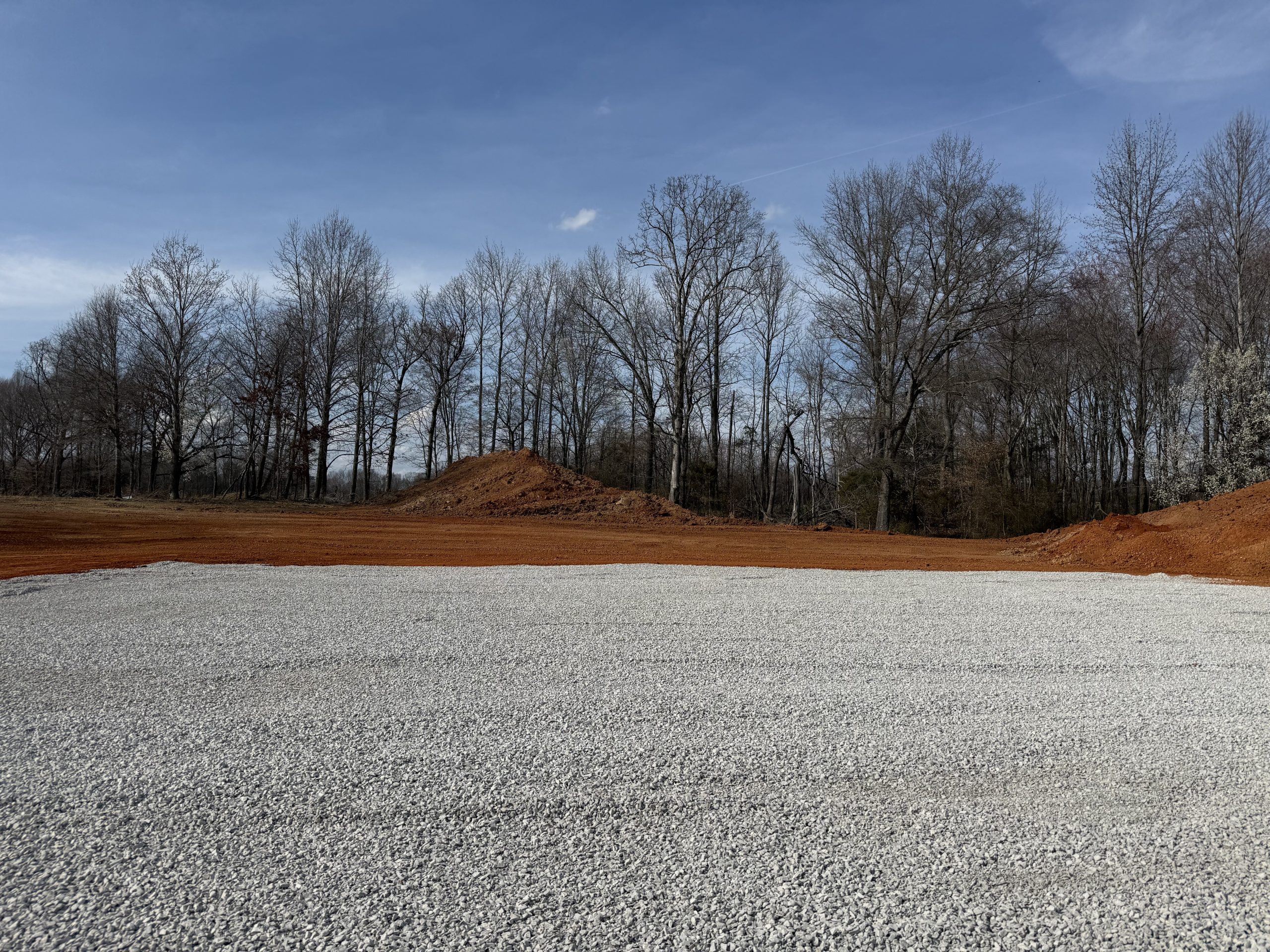 Compacted gravel building pad prepped for construction near McMinnville, Tennessee